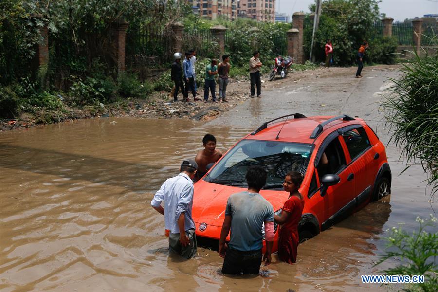 NEPAL-KATHMANDU-RAIN-STUCK CAR